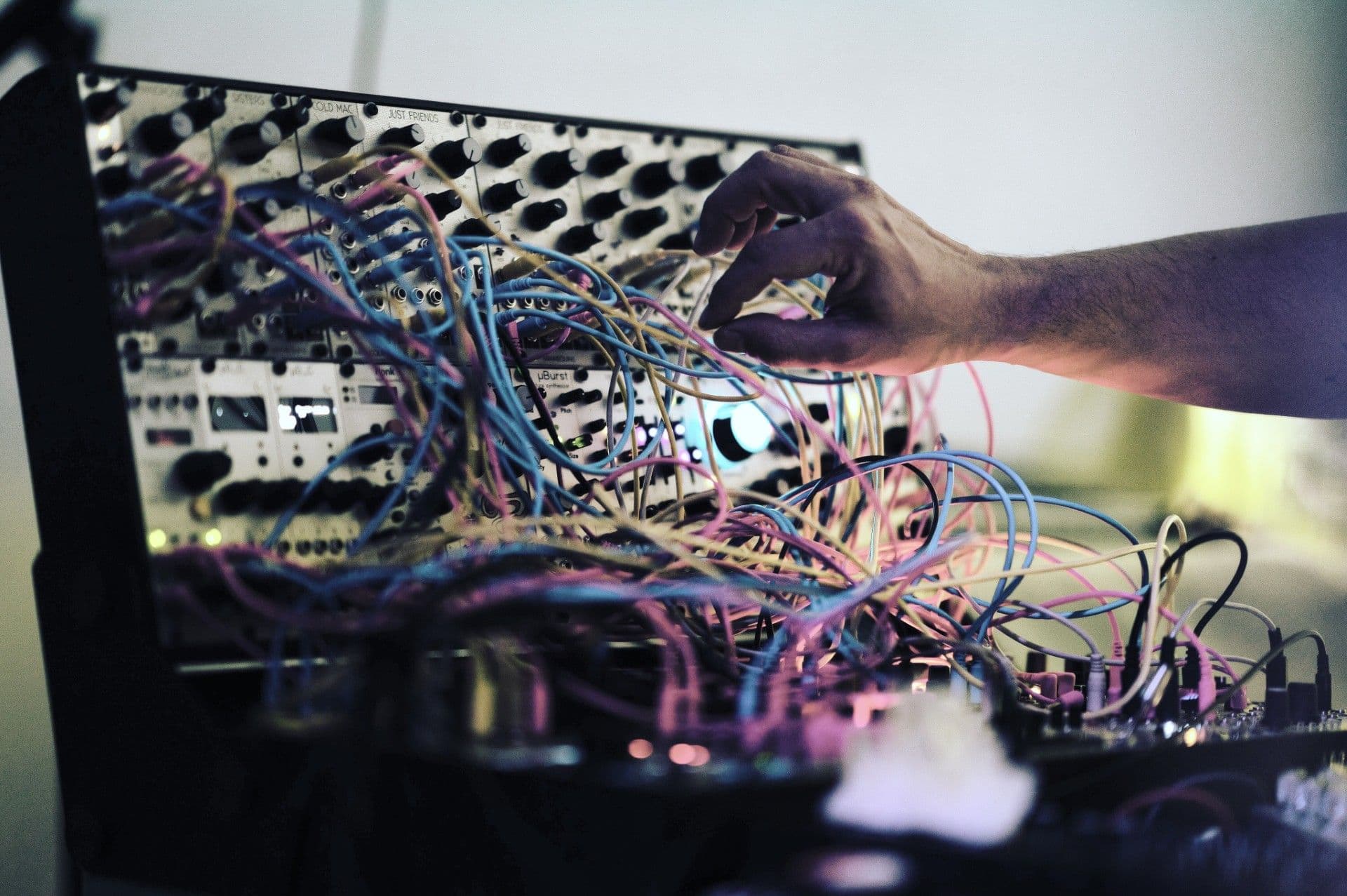 A synthesizer full of colourful cords